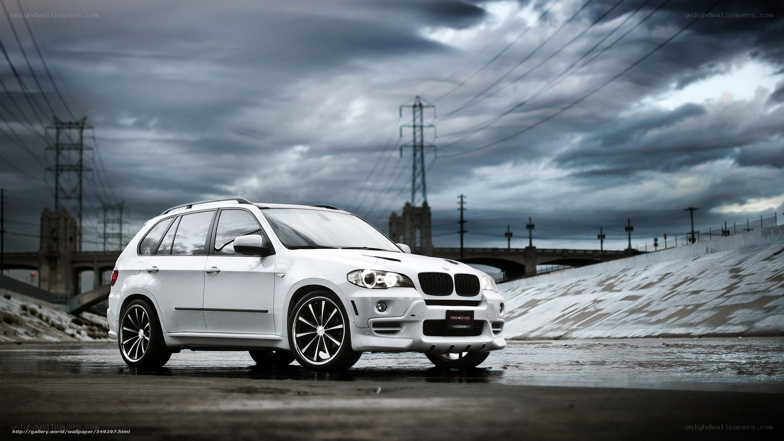 White BMW SUV on wet road
