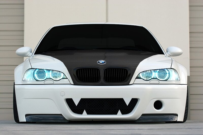 white bmw with blue headlights