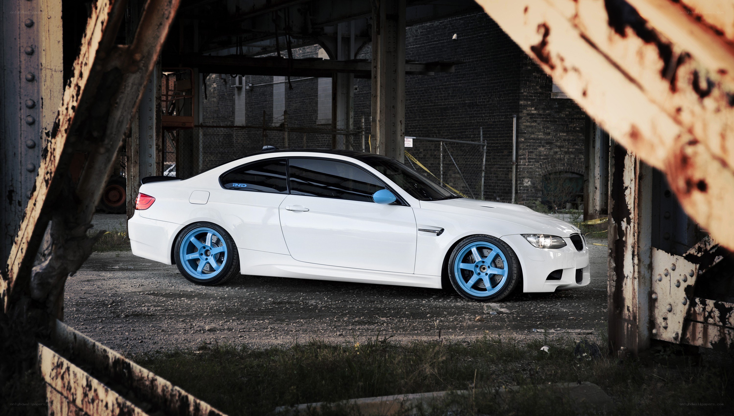white bmw with blue wheels