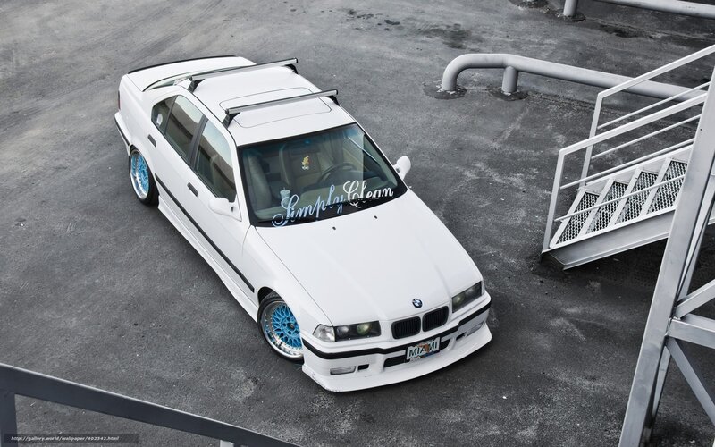 white bmw with blue wheels