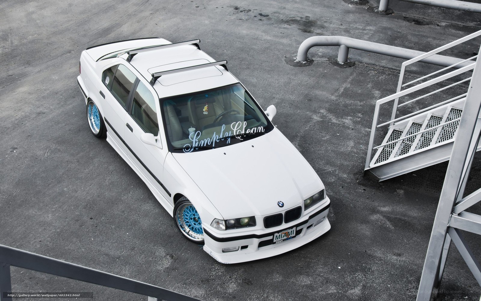 white bmw with blue wheels