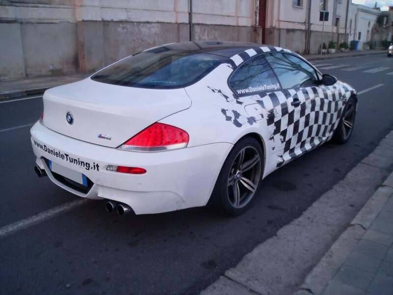 white bmw with checkered wrap
