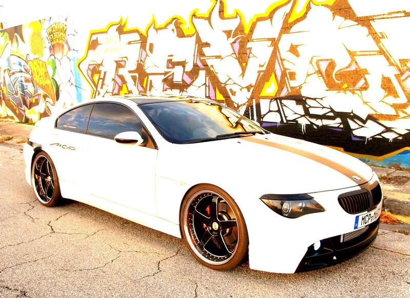 White BMW with graffiti background