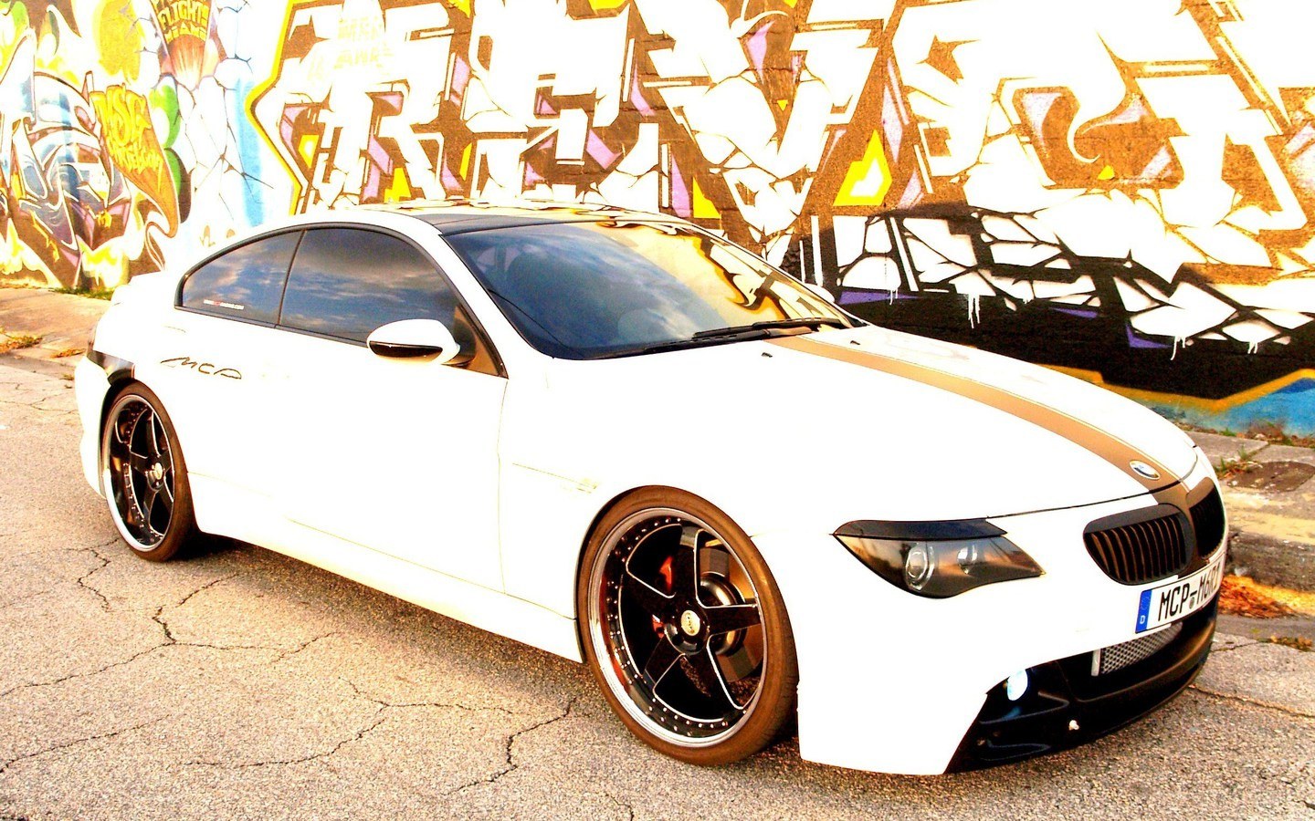 white bmw with graffiti background