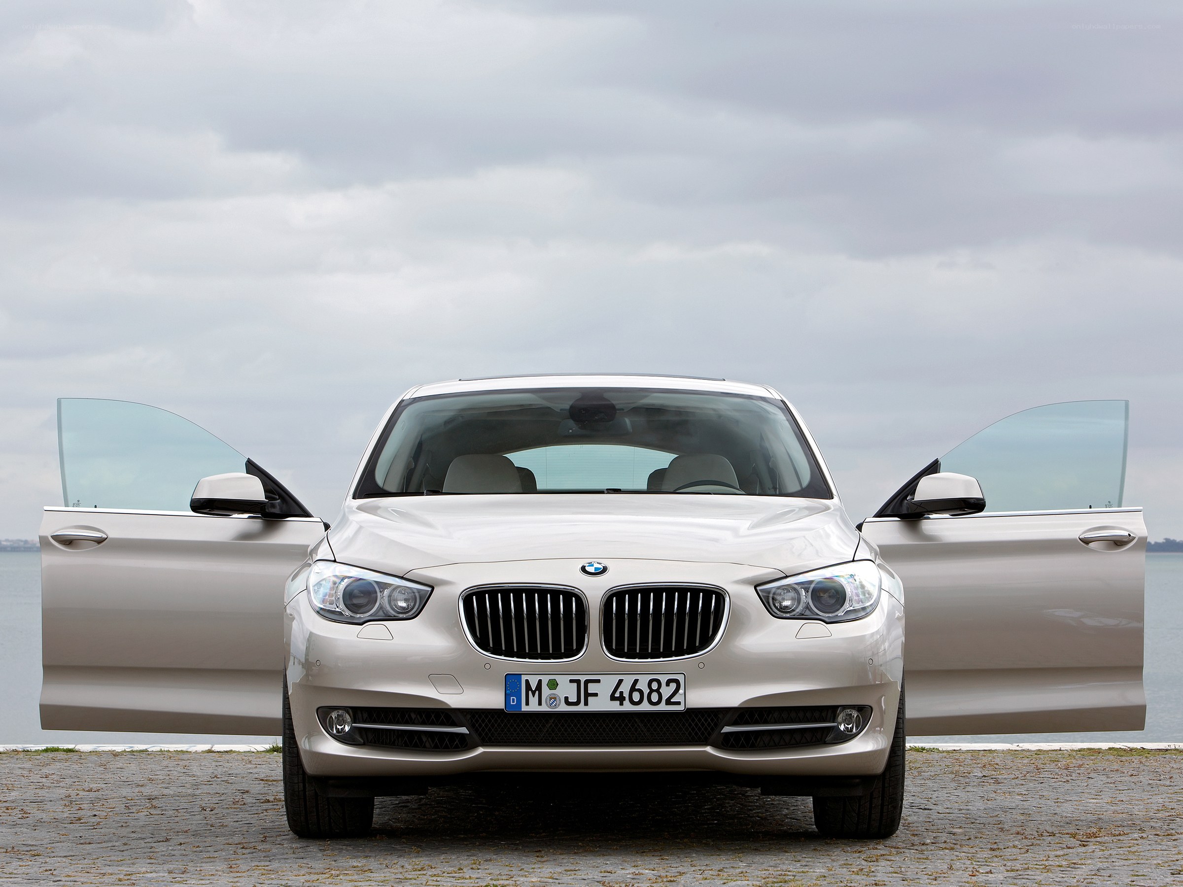 White BMW with open doors