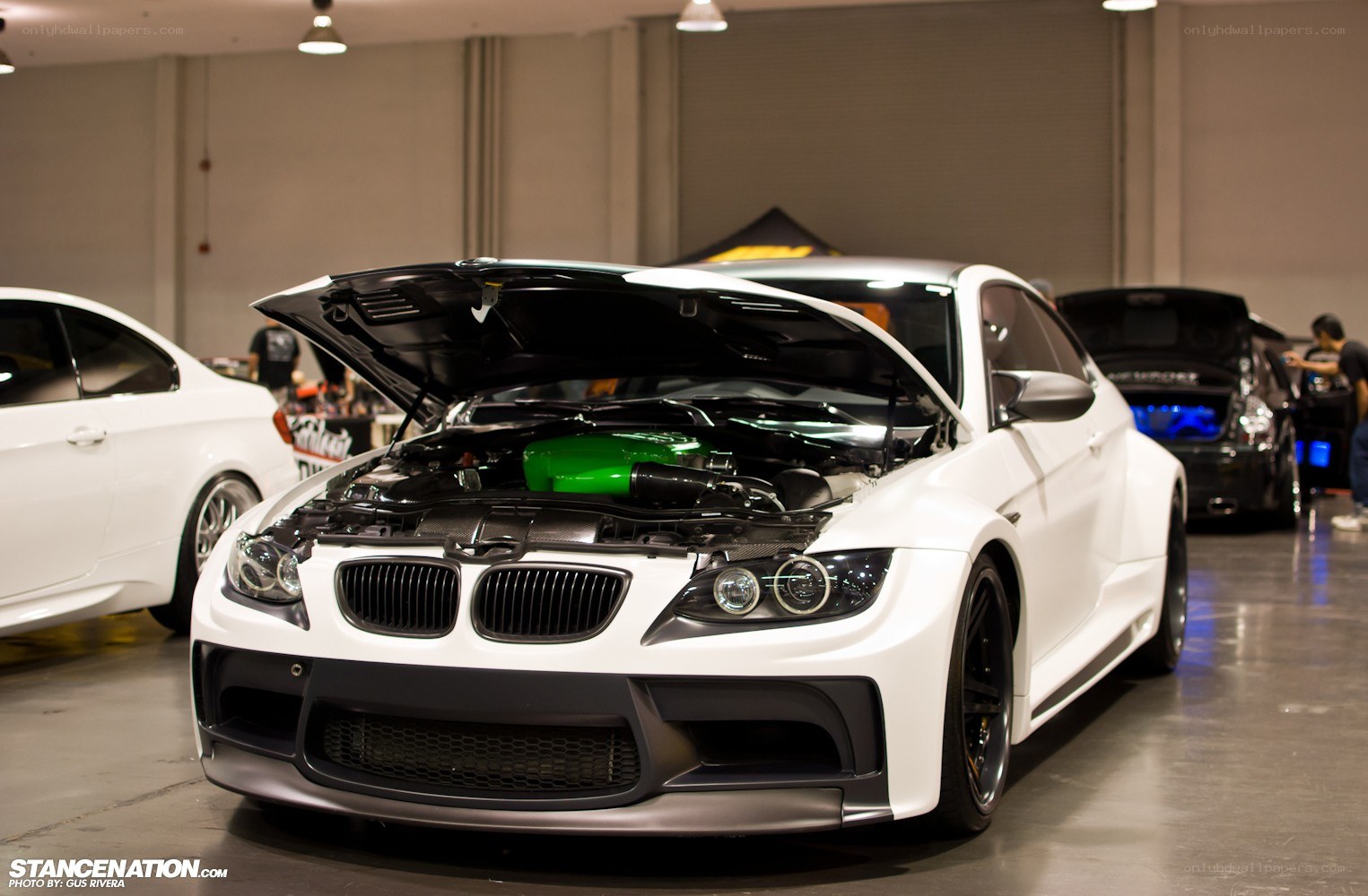 White BMW with open hood