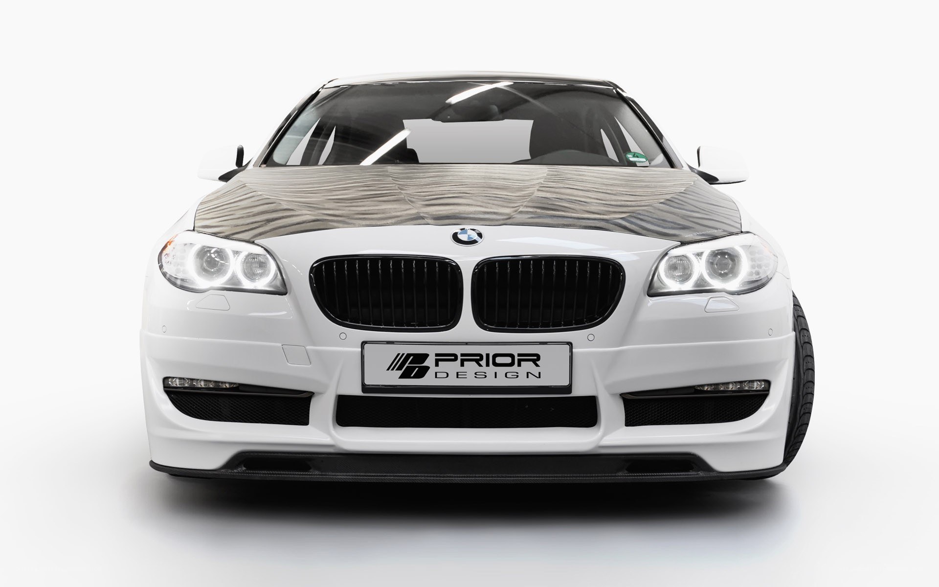 white bmw with prior design front