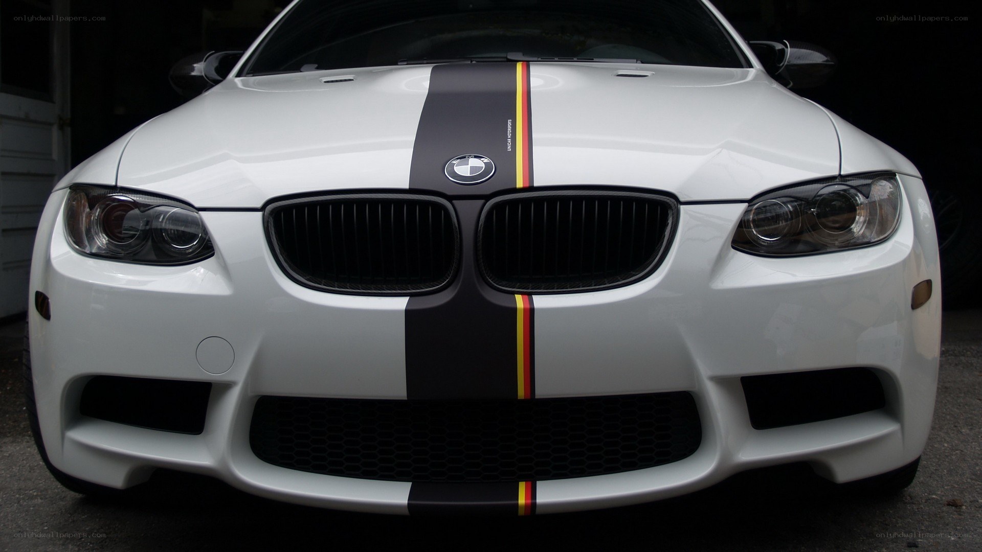 white bmw with racing stripes