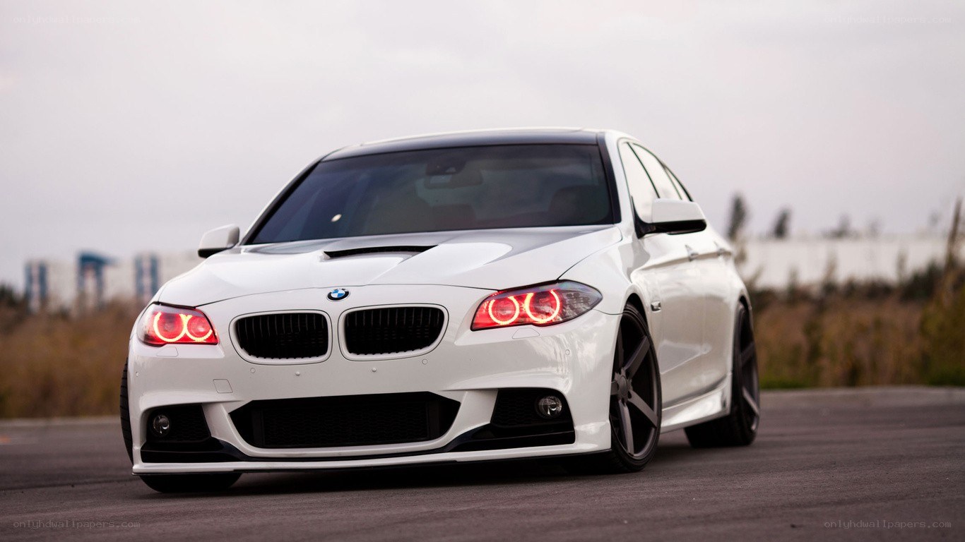 white bmw with red headlights