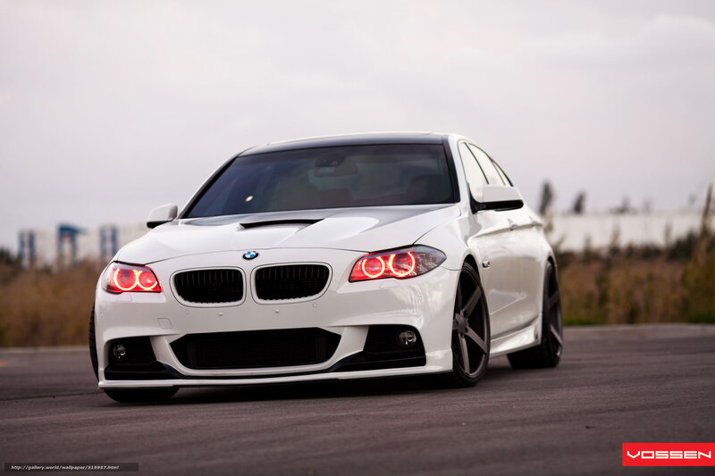 white bmw with red headlights