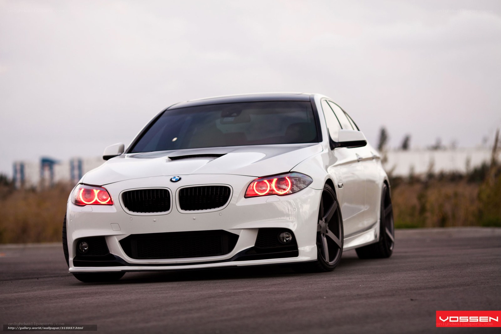 white bmw with red headlights