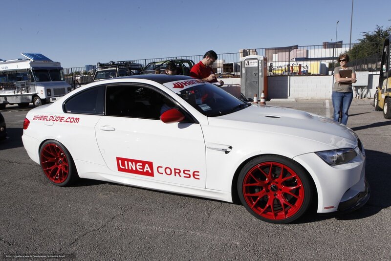 White BMW with red wheels