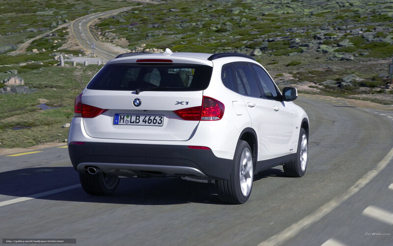 white bmw x1 on winding road