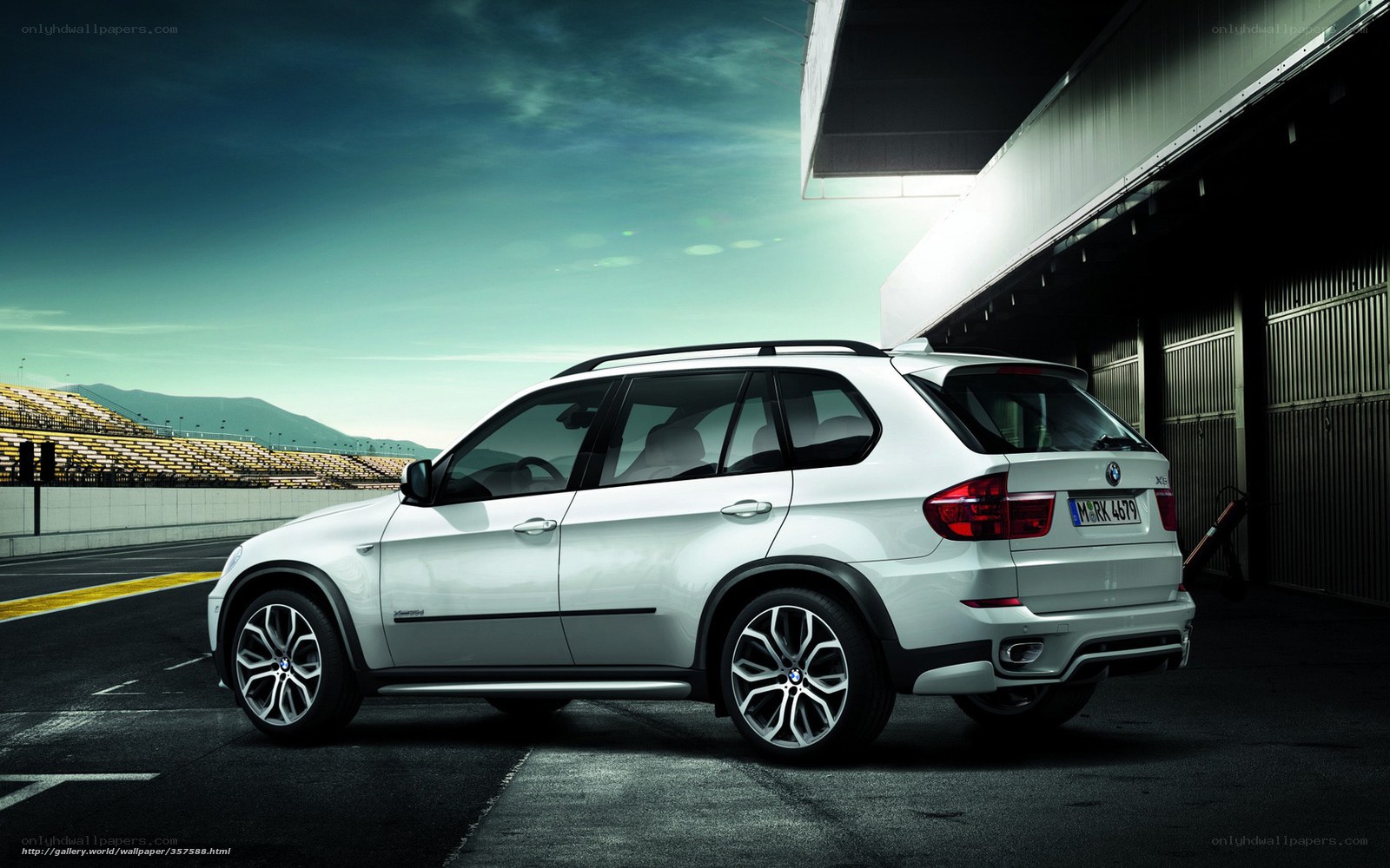 White BMW X5 on racetrack