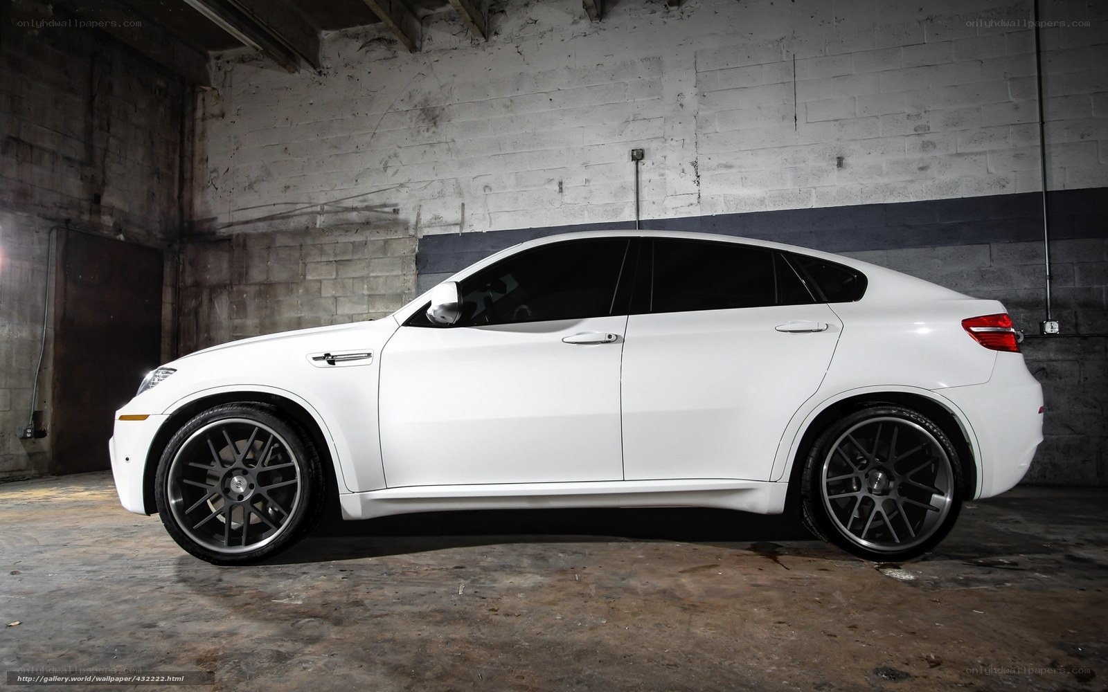 white bmw x6 m in garage