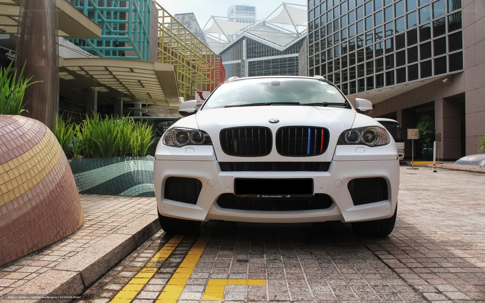 White BMW X6 M parked outside