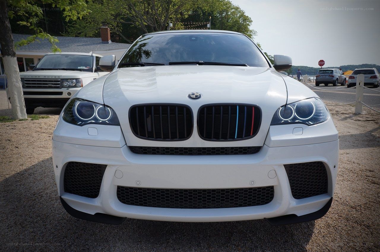 white bmw x6 m parked