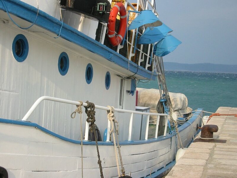 white boat at the dock