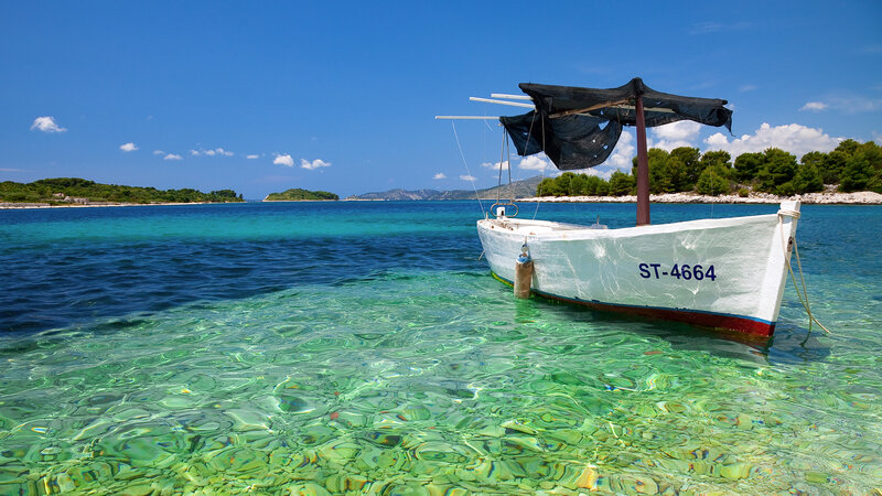 White Boat in Clear Water — Blue, Serene, Afternoon, Photograph, Island