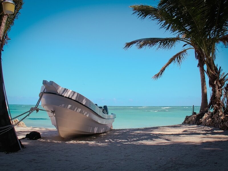 White Boat on Beach — Blue, Serene, Afternoon