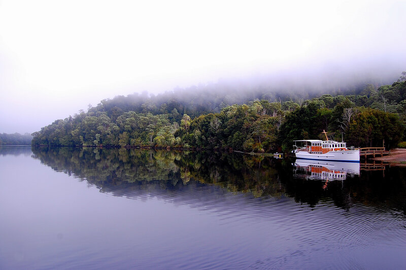 White Boat on Lake — Blue