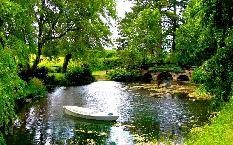 White Boat on River — Green, Serene