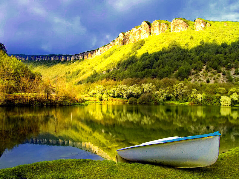 White Boat on Riverbank