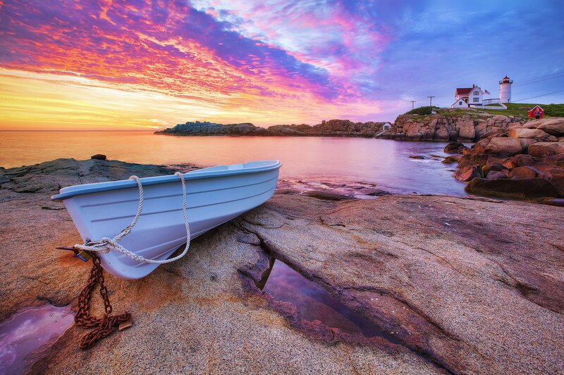 White Boat on Rocks