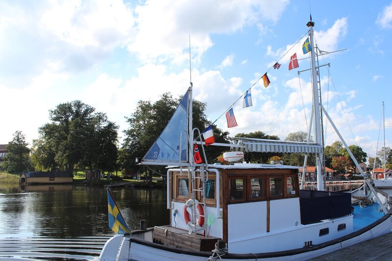White Boat with Flags