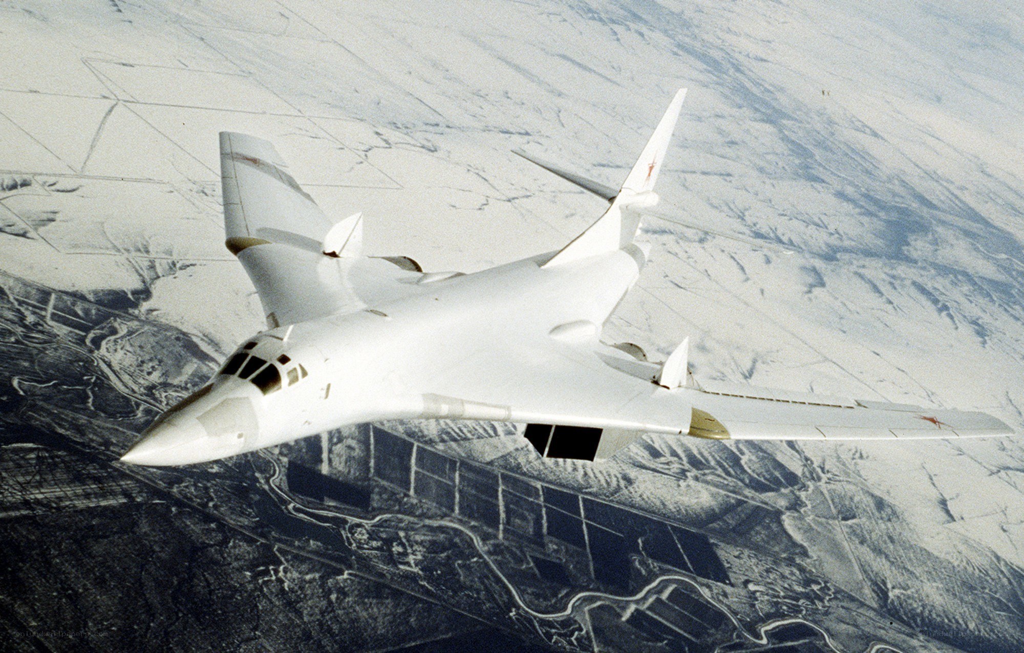 White bomber aircraft in flight