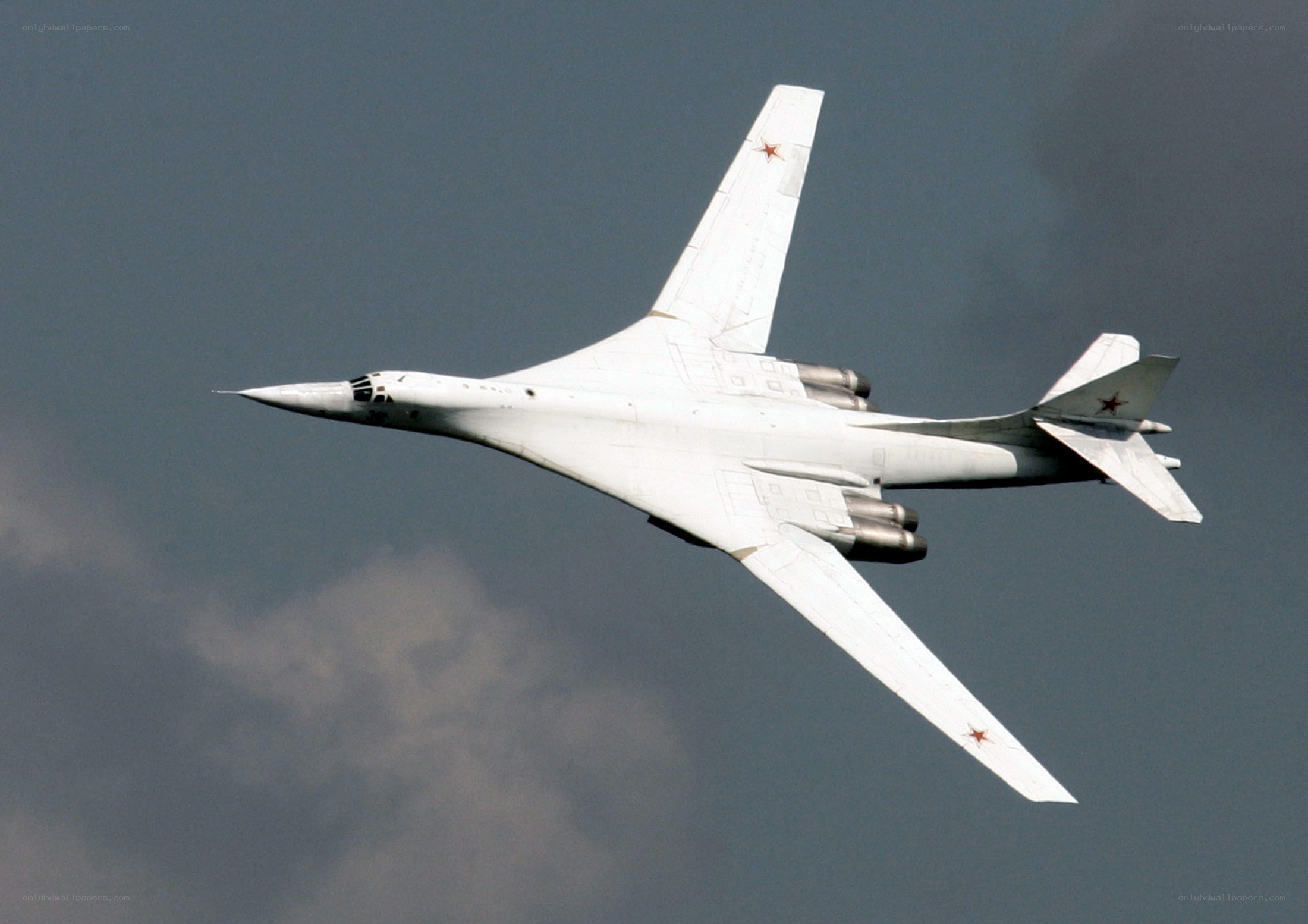 White bomber aircraft in flight