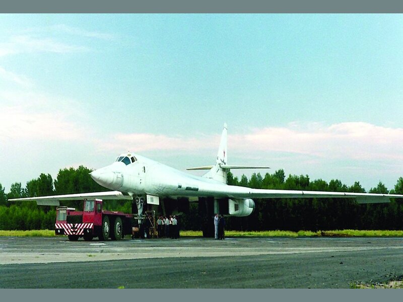 White bomber aircraft on tarmac