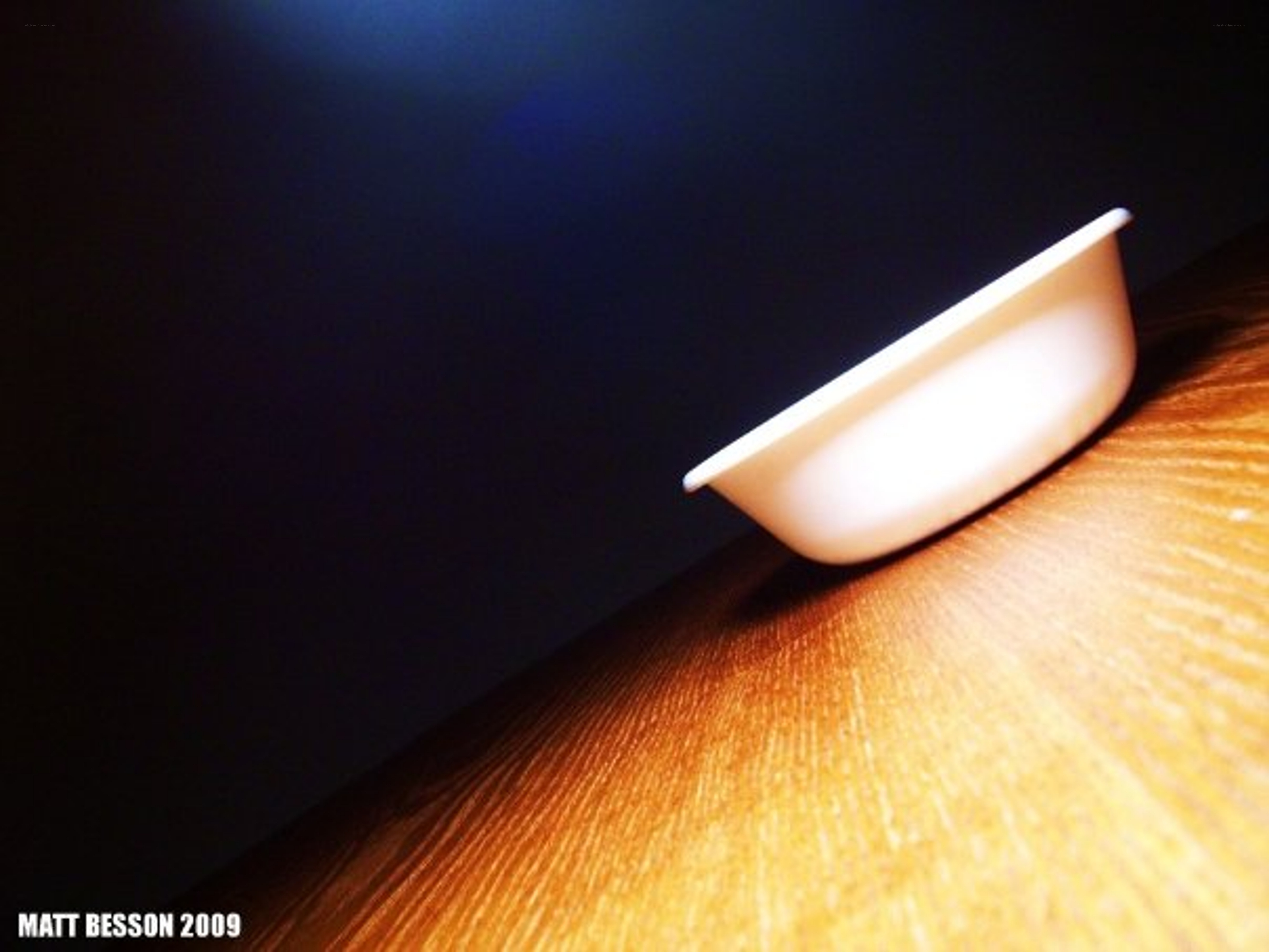 White bowl on wooden surface