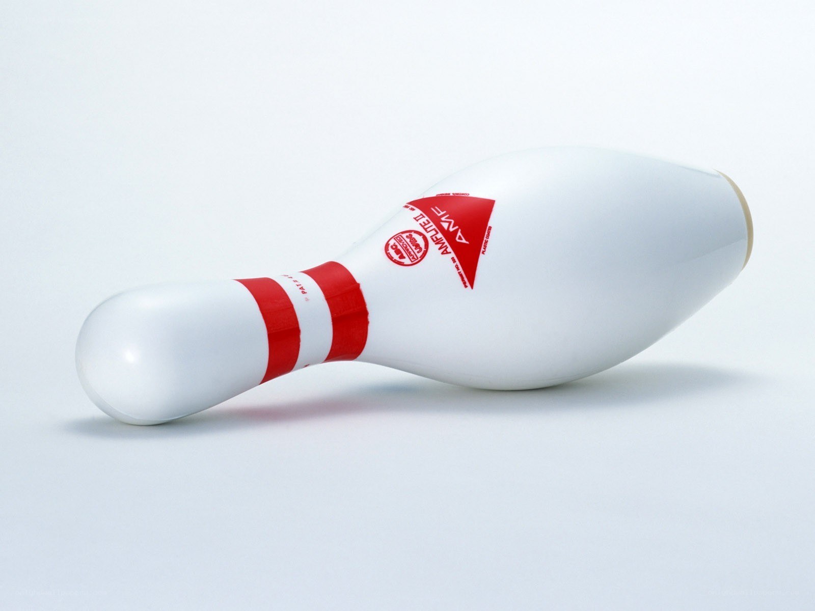 white bowling pin with red stripes