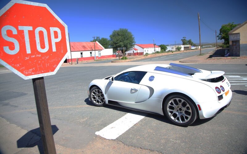 White Bugatti at stop sign