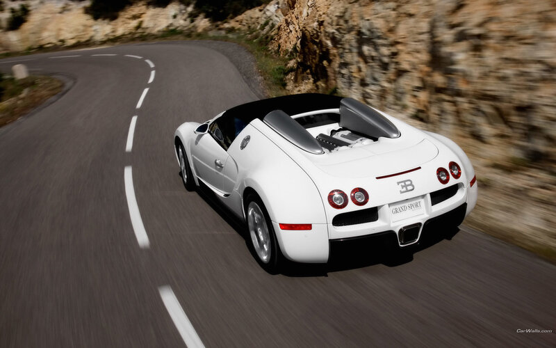 White Bugatti Grand Sport on winding road