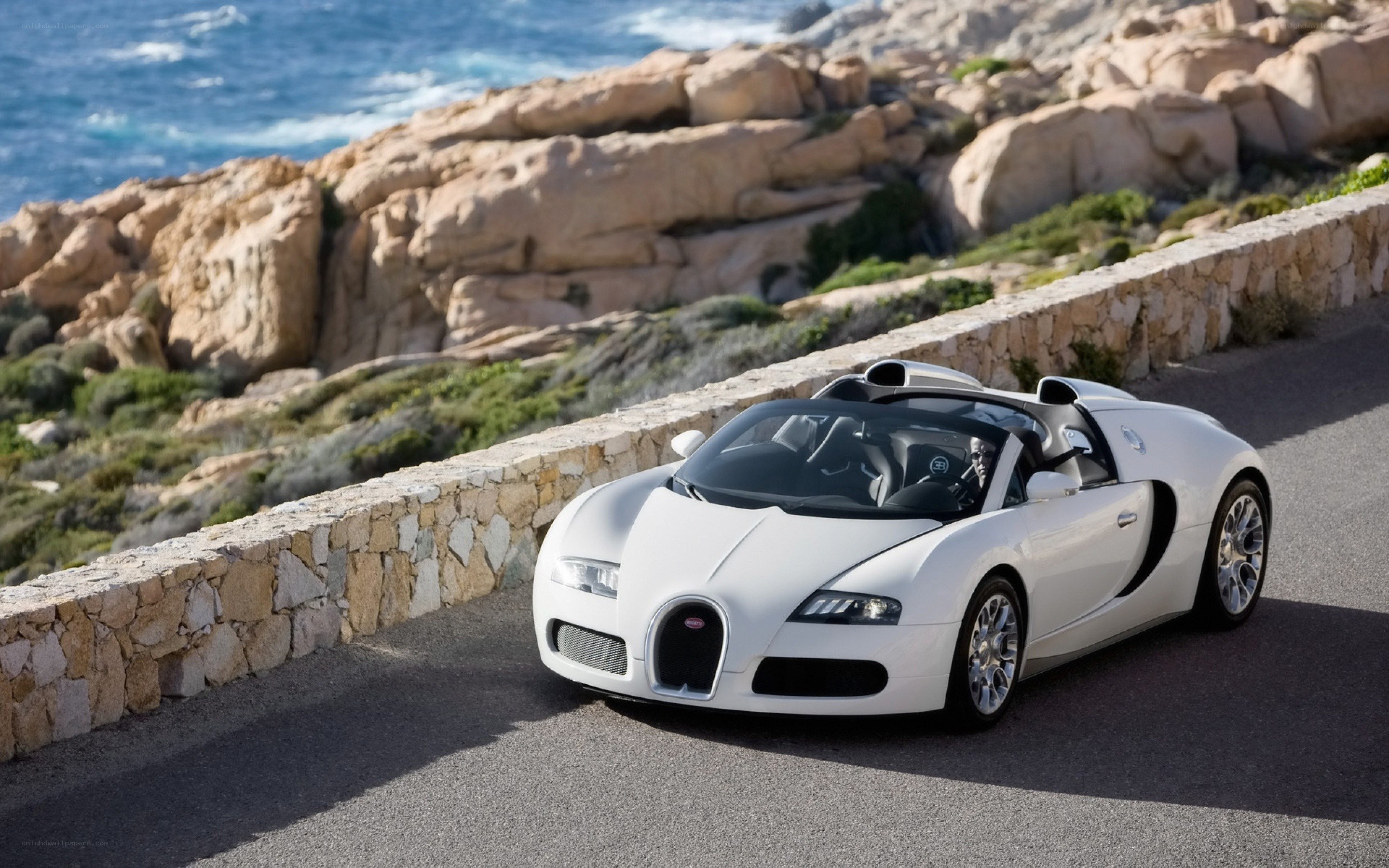 White Bugatti on coastal road
