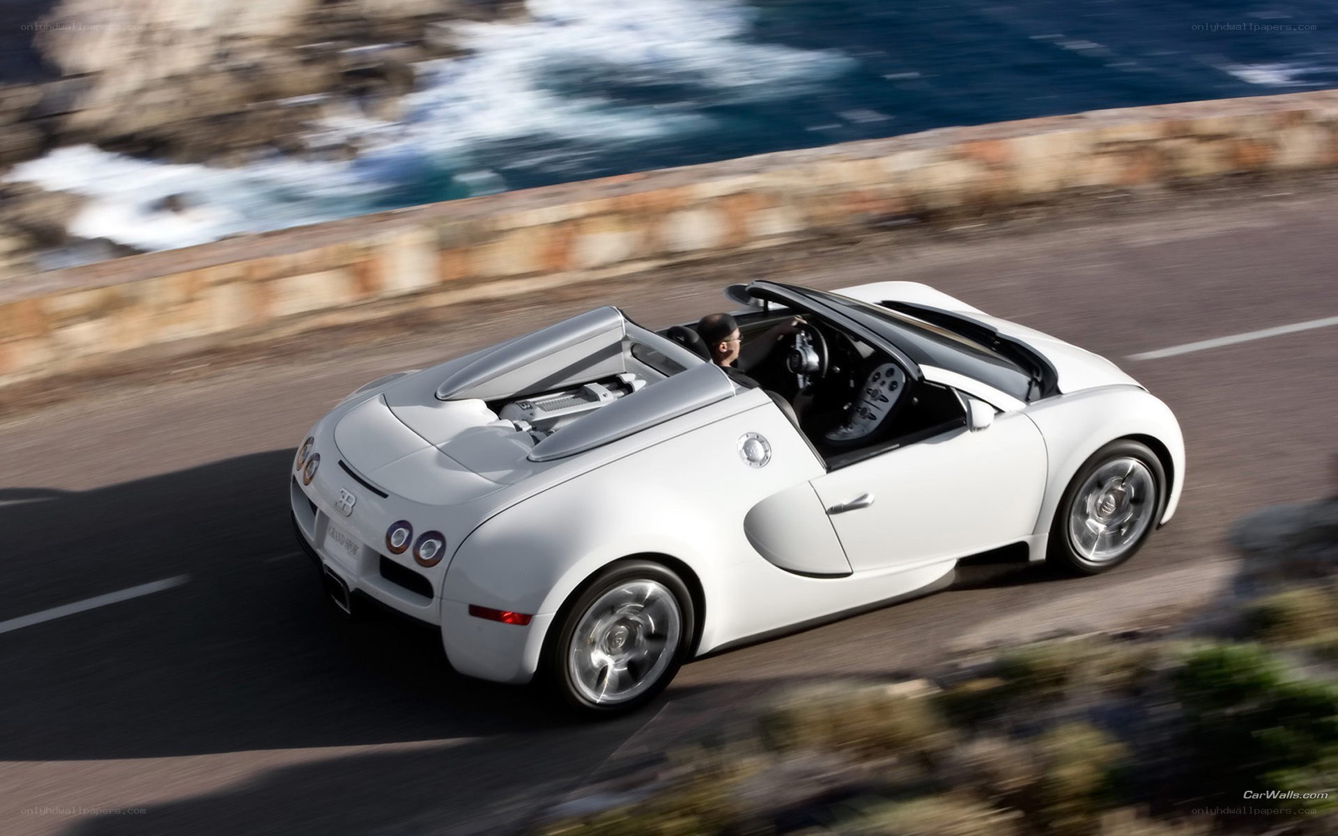 White Bugatti on coastal road