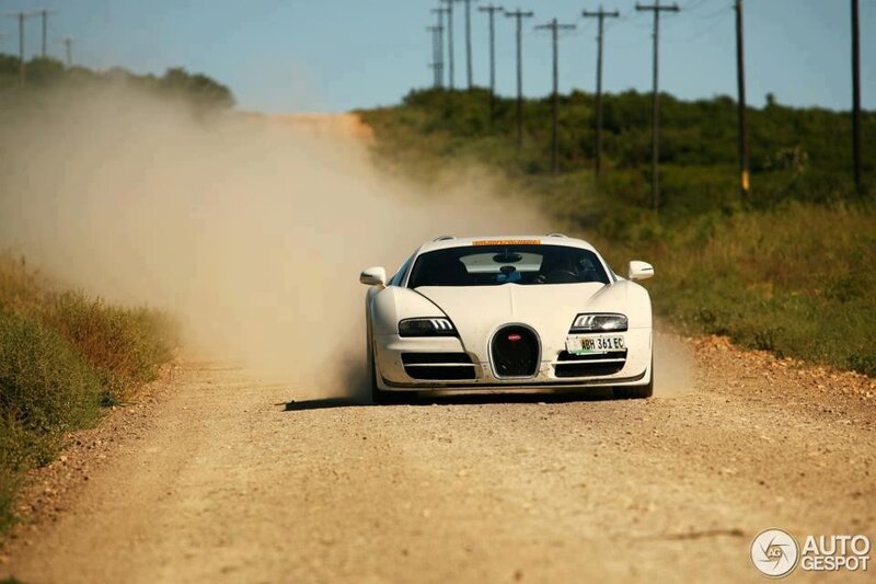 white bugatti on dirt road