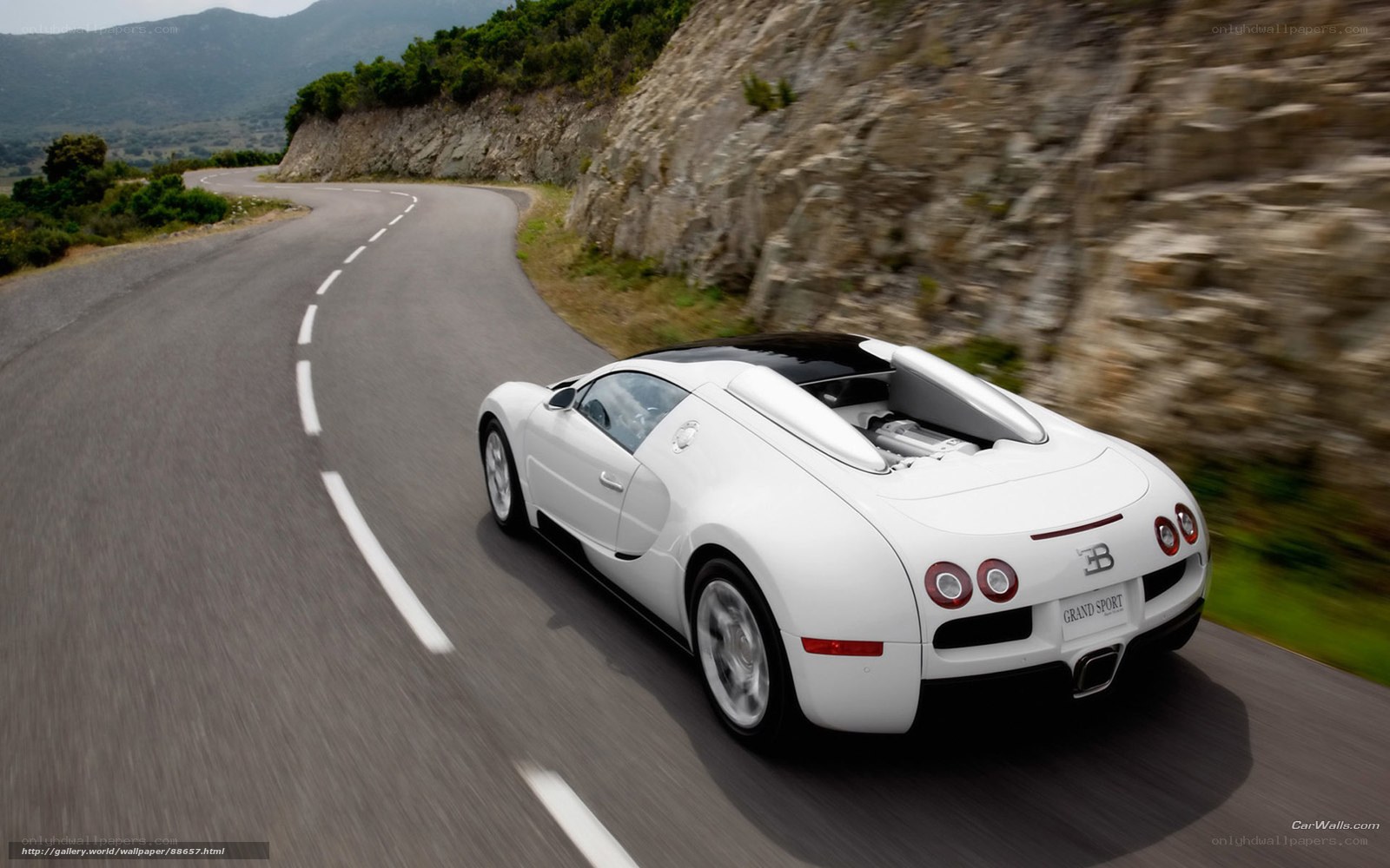 white bugatti on winding road