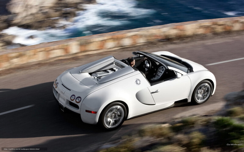 White Bugatti Veyron driving on coastal road
