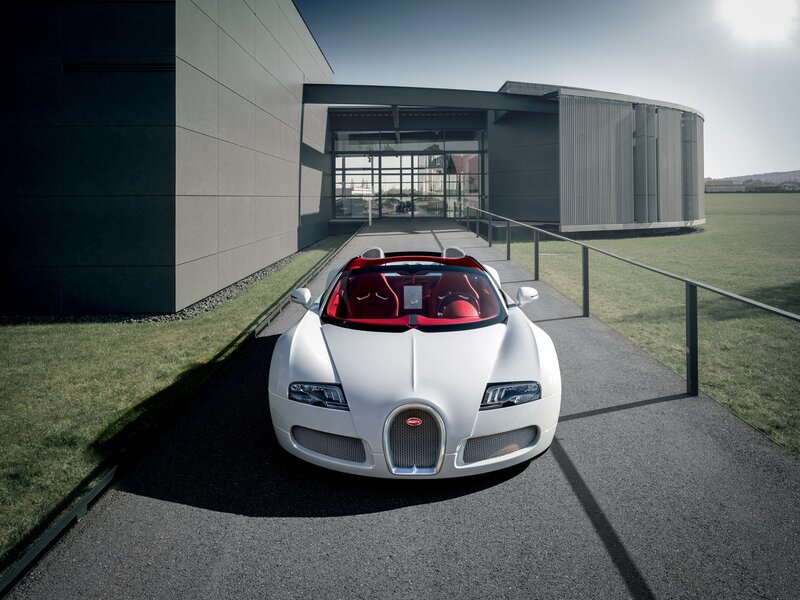 White Bugatti Veyron in front of building