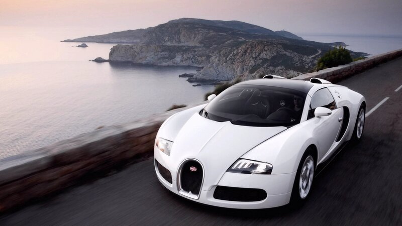 White Bugatti Veyron on coastal road