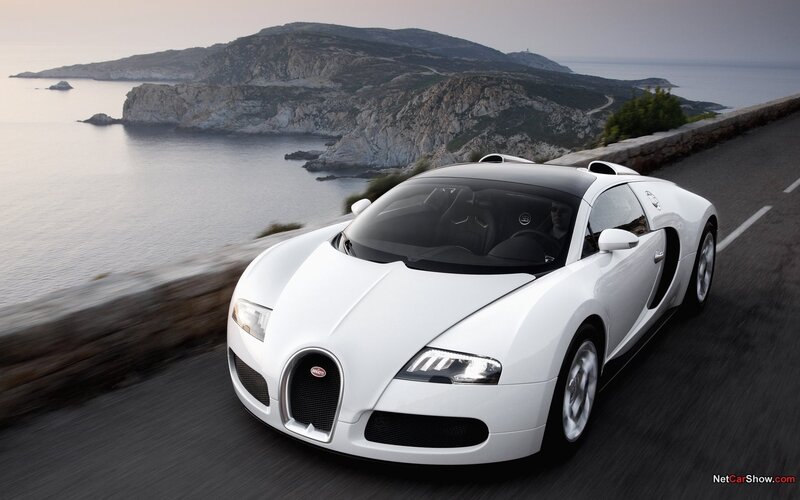 White Bugatti Veyron on coastal road