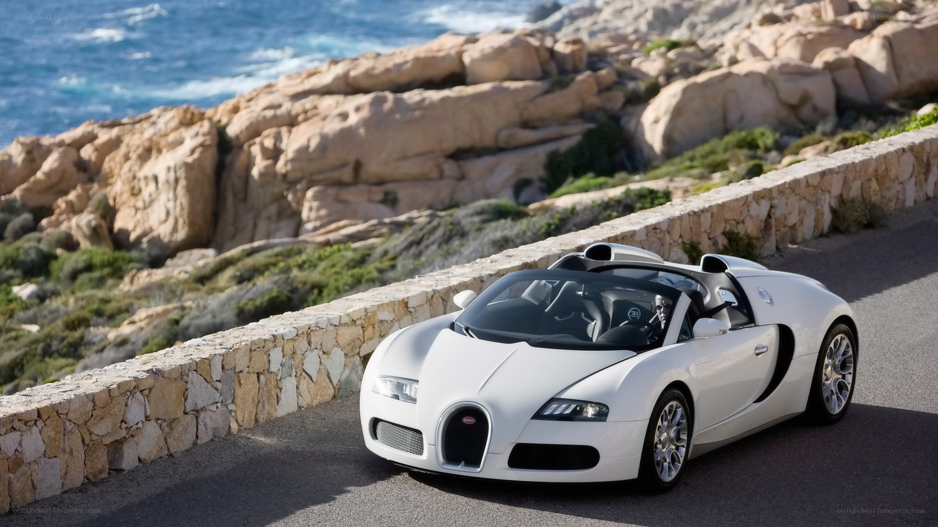 White Bugatti Veyron on coastal road