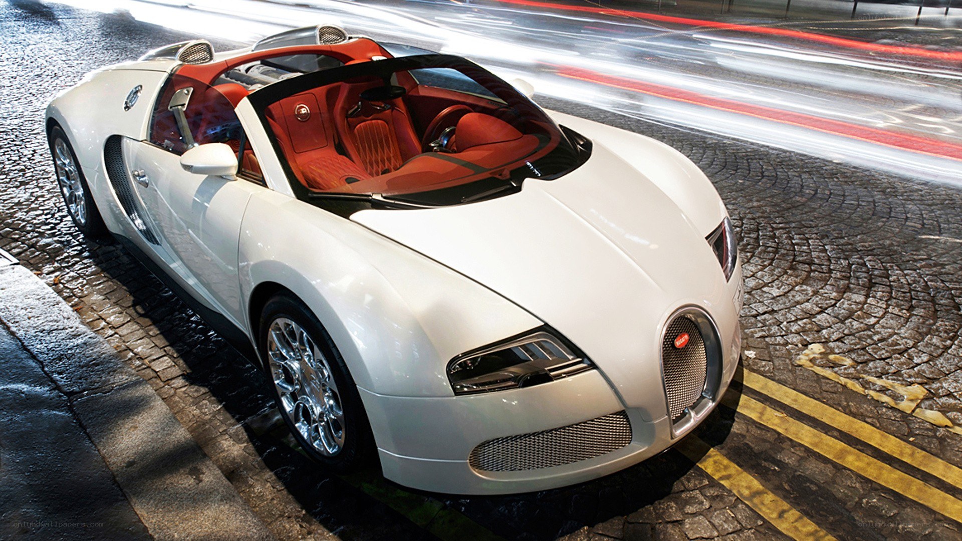 White Bugatti Veyron on cobblestone street