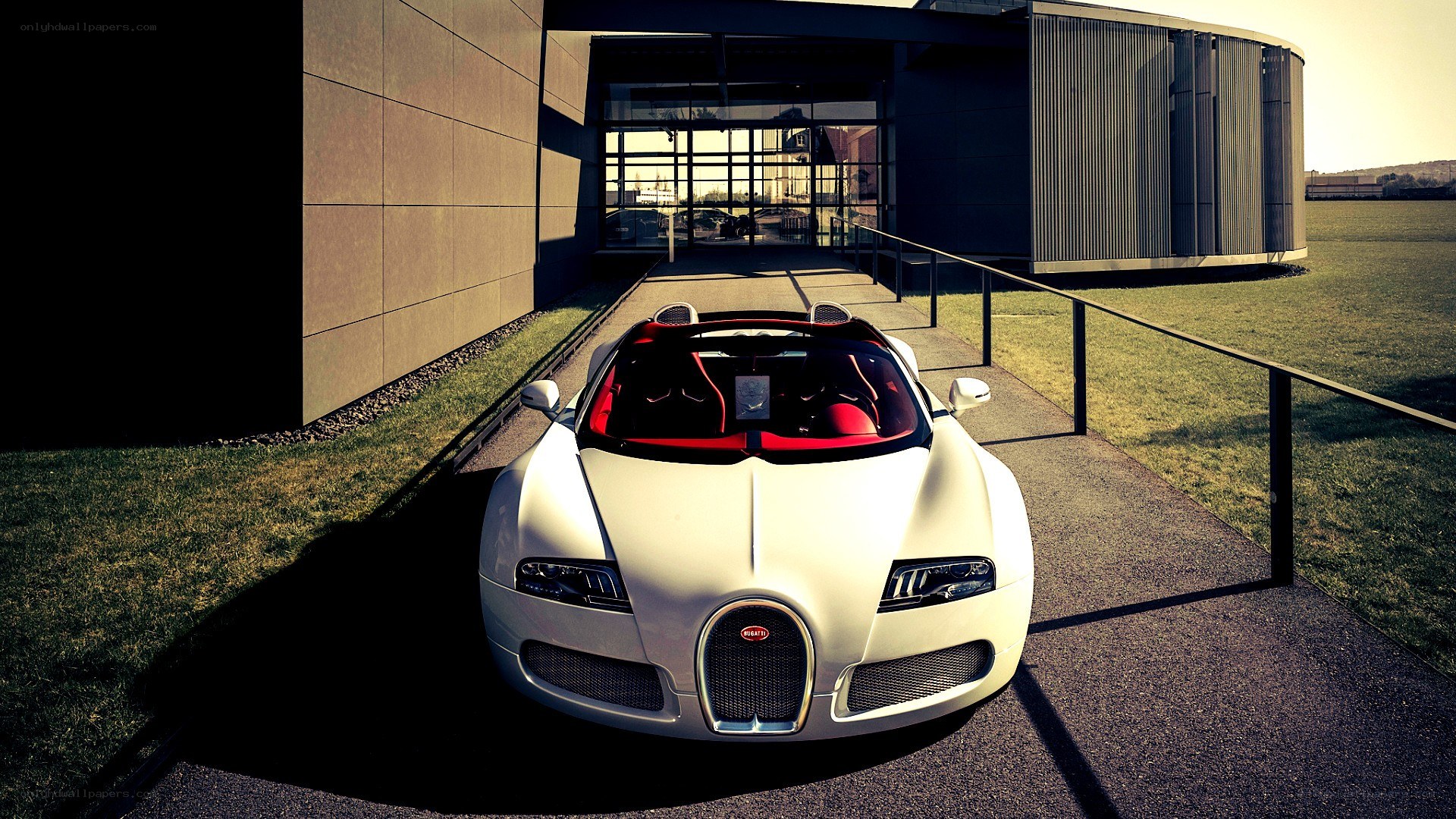 White Bugatti Veyron parked outside