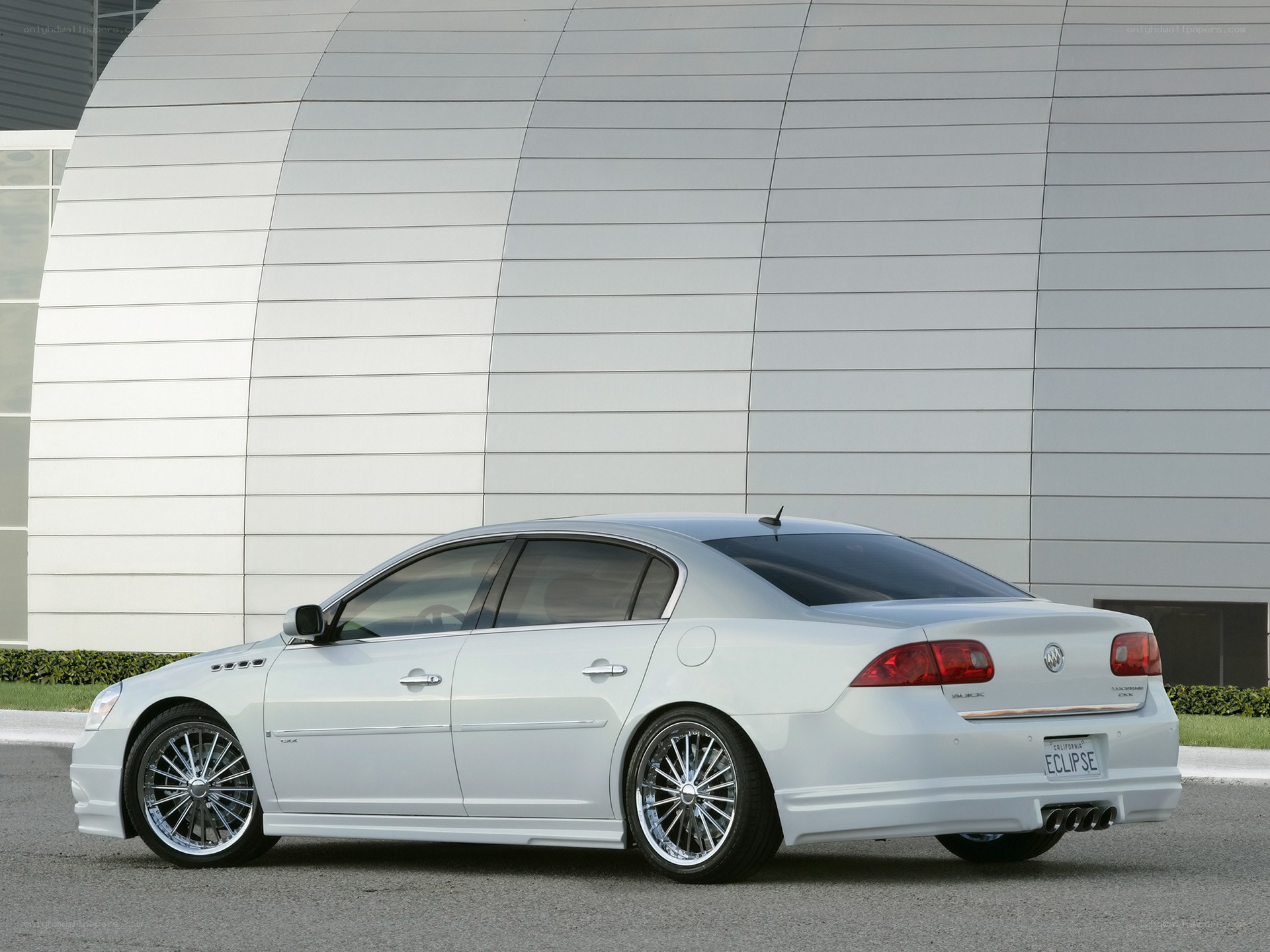 White Buick sedan parked outside