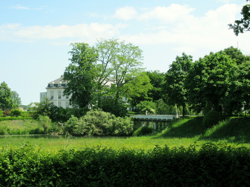 White Building Behind Trees