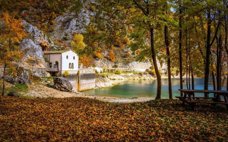White Building by Lake — Green, Serene